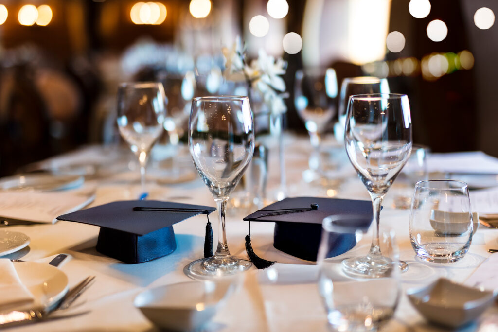 A graduation cap on a set table