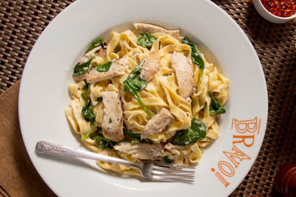 Pasta Woozie on a Bravo plate with fettucine, chicken, and spinach